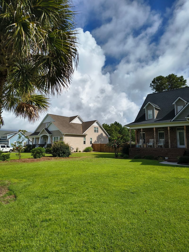 The lawn at the Holly Ridge job after the work, with no ruts or track marks across the grass.
