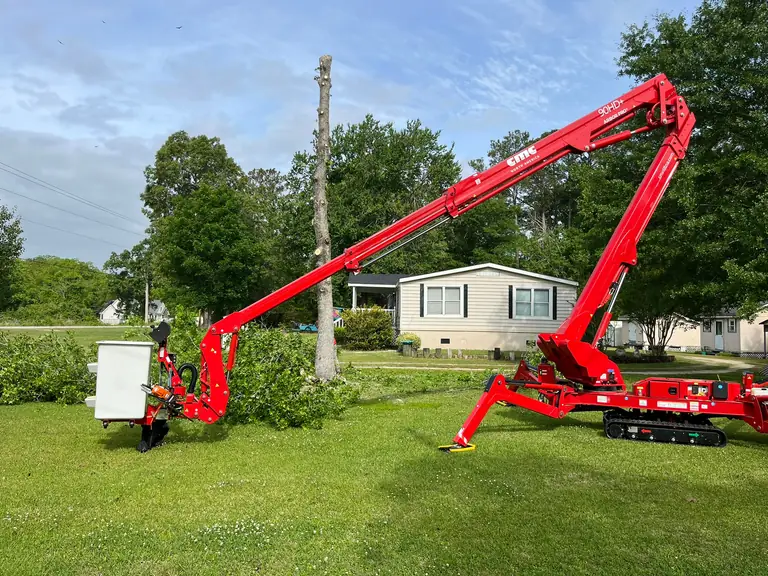 90-foot spider lift fully extended for tree removal over a house in Onslow County, NC